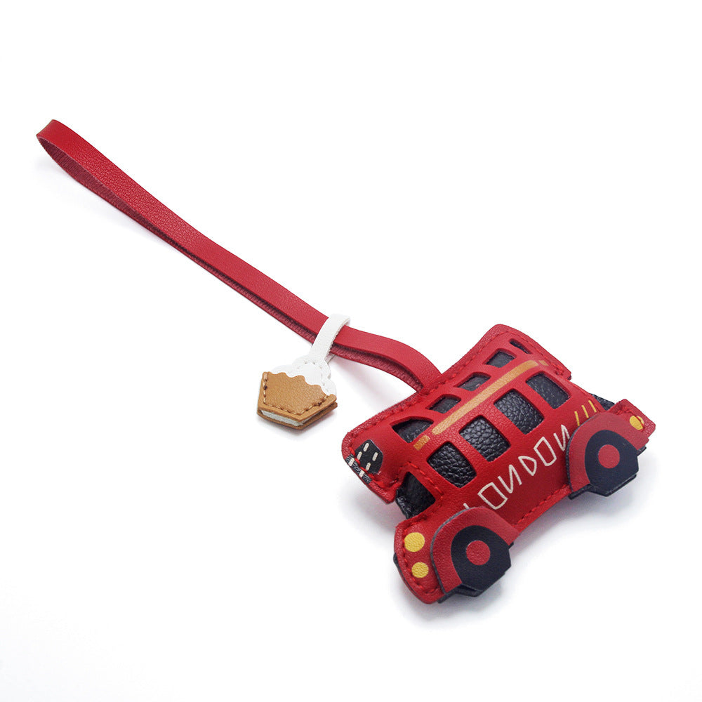 A vibrant red PU leather keychain designed as a classic London double-decker bus, complete with a secure strap and clasp, perfect as a bag charm.