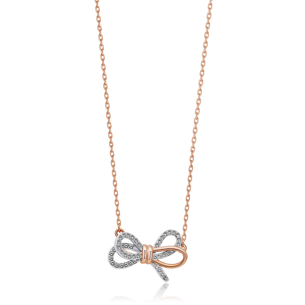 Close-up of the Tied Ribbon Bow Necklace, showcasing the rose gold and rhodium plated bow pendant encrusted with clear cubic zirconia.