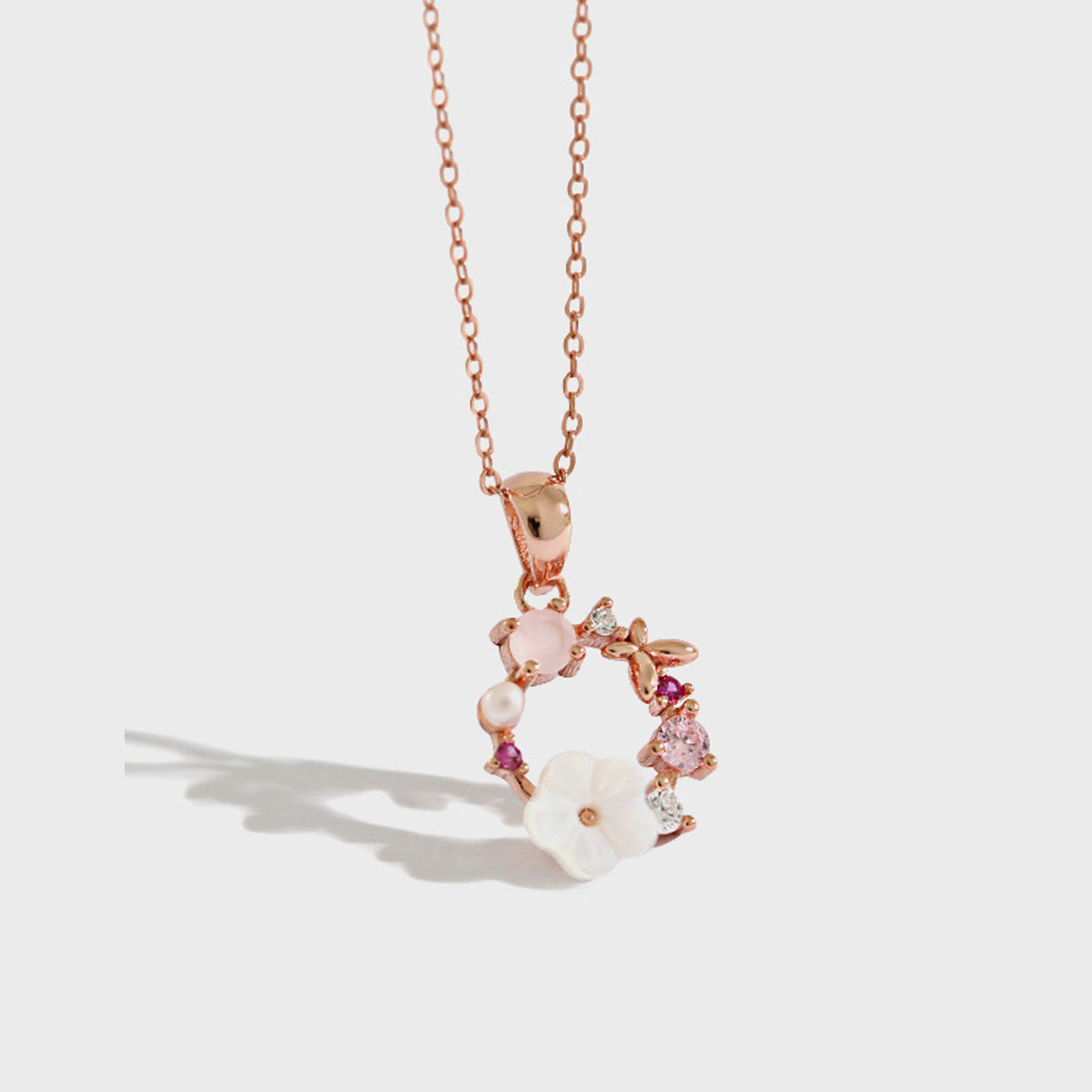 A 925 sterling silver necklace with a rose gold plated floral wreath pendant, showcasing a minimalist Korean-style design on a clean white background. Ideal for wholesale jewelry collections.