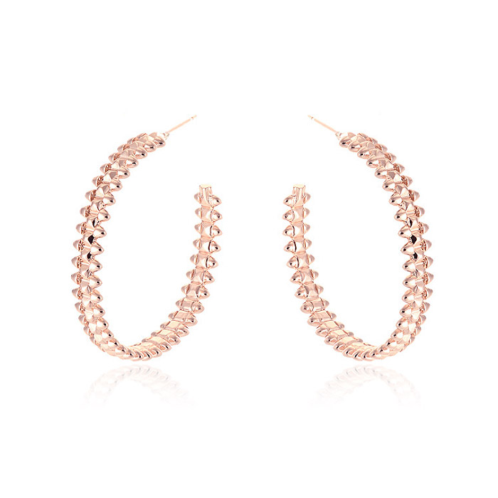 A close-up of the Large Textured 40MM Hoop Earrings in rose gold, highlighting the intricate chain-link texture and polished finish.