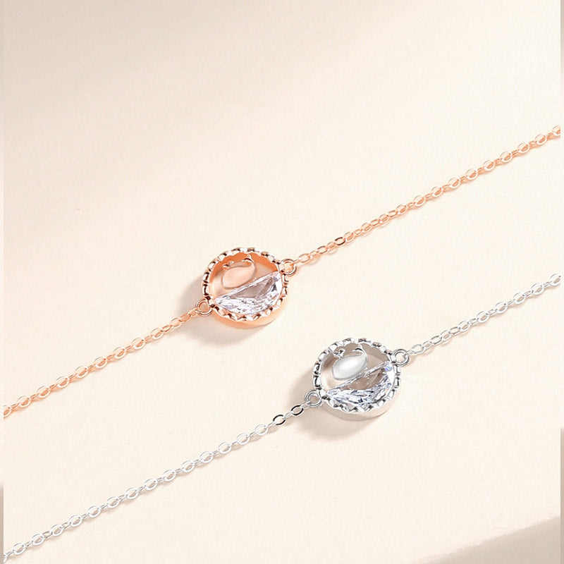 A pair of 925 sterling silver charm bracelets, one in silver and one in rose gold, showcasing the available color options for the whale charm bracelet set.