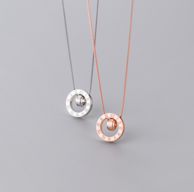 A stunning 925 Sterling Silver Roman Numeral Pendant shown in both polished silver and elegant rose gold finishes, highlighting its versatile and timeless design.