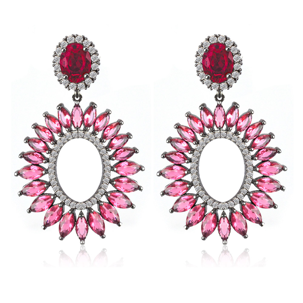 A pair of ornate Red Radiant CZ Earrings with red and pink gemstones and clear cubic zirconia, set in a symmetrical, dark hematite-plated metal design.