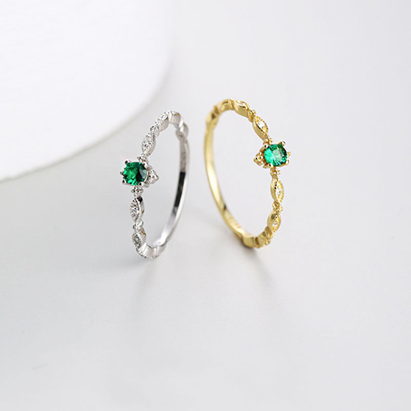A set of 925 sterling silver rings in both silver and gold finishes, featuring an elegant multi-horse-eye design with inlaid emerald green zircon gemstones.