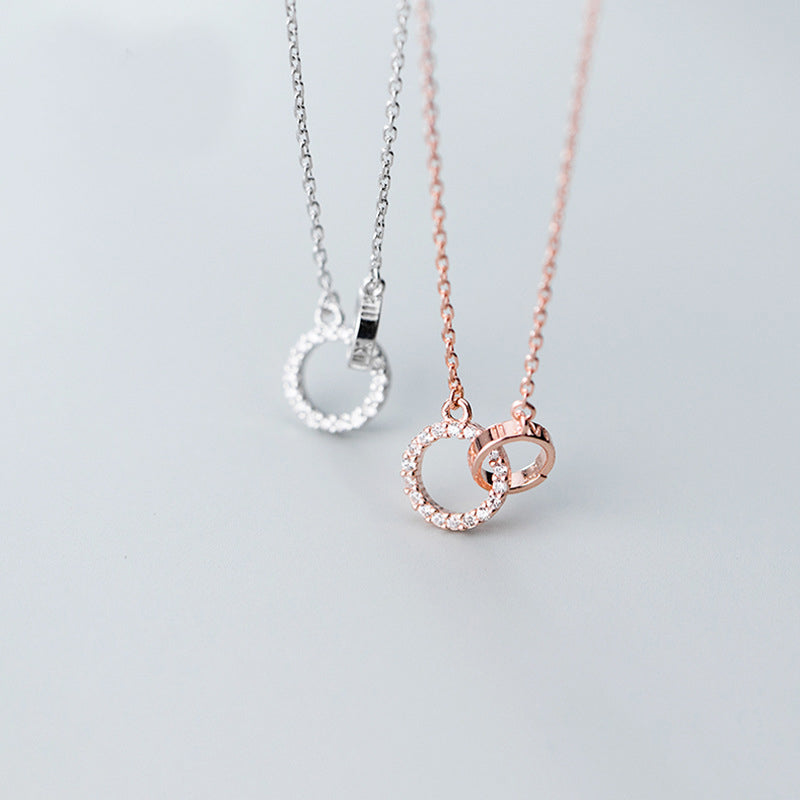 A set of 925 sterling silver interlocking circle pendant necklaces, one in a polished silver finish and the other in a warm rose gold finish, displayed on a clean background.
