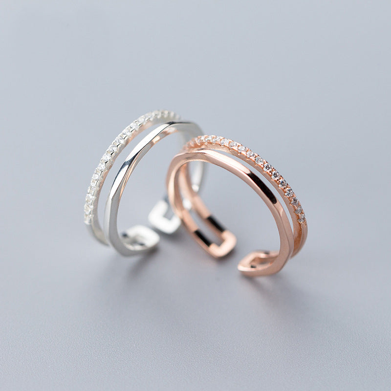 A pair of elegant 925 sterling silver two-layered adjustable rings, one in silver and one in rose gold finish, from the set of 5.