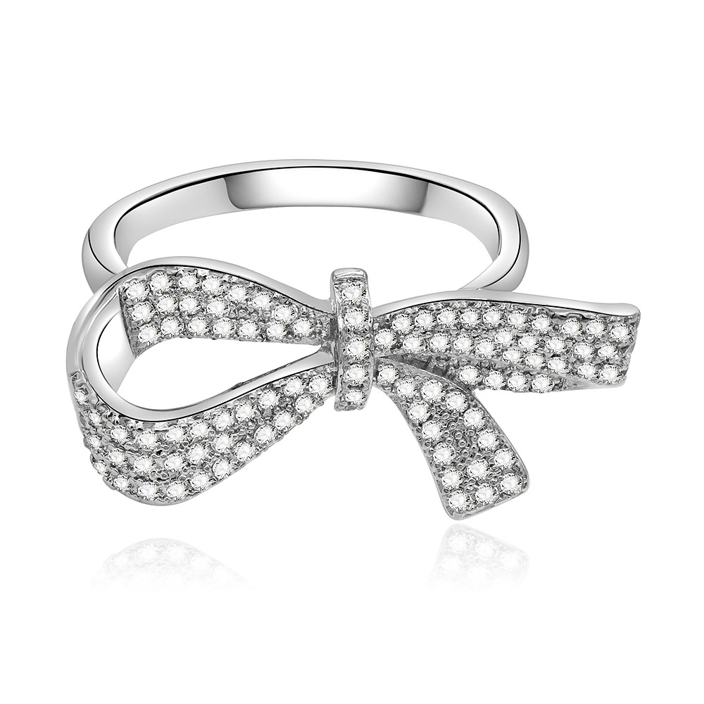 Front view of the Large Charming Bow Ring, showcasing its intricate bow design crafted from rhodium-plated brass and pave-set with sparkling cubic zirconia stones.