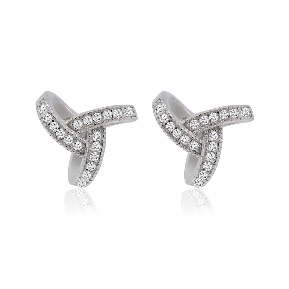 A pair of Love Knot Me stud earrings in rhodium-plated brass, featuring a crisscross design studded with sparkling cubic zirconia.