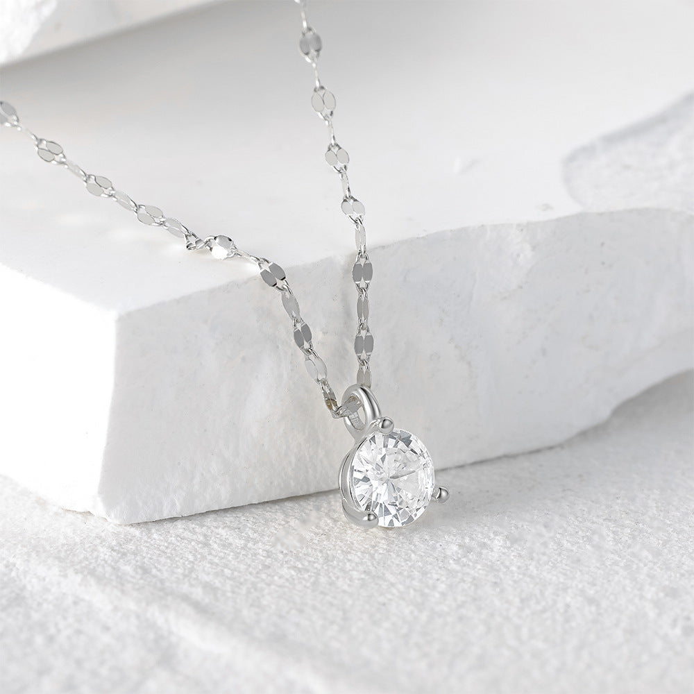 Close-up of a 925 sterling silver necklace featuring a single 6mm crystal stone in a 3-prong setting, on a white background.