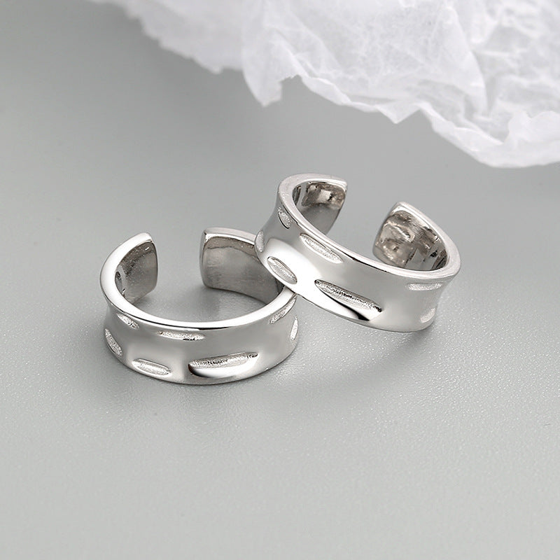 A pair of 925 sterling silver wide helix ear cuffs with a polished finish, designed for a no-piercing look.