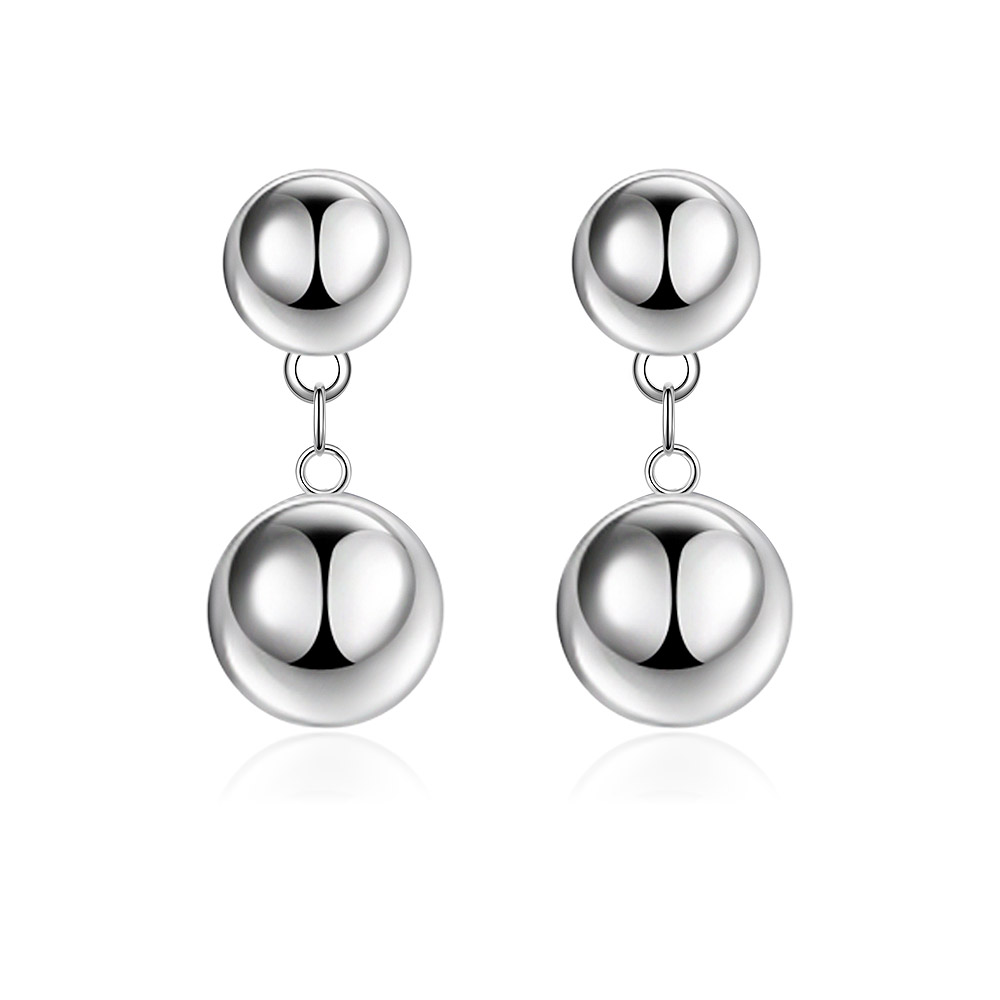 A pair of shiny rhodium-plated sphere ball dangle earrings, featuring a small ball connected to a larger one, showcasing their polished, reflective finish against a white background.