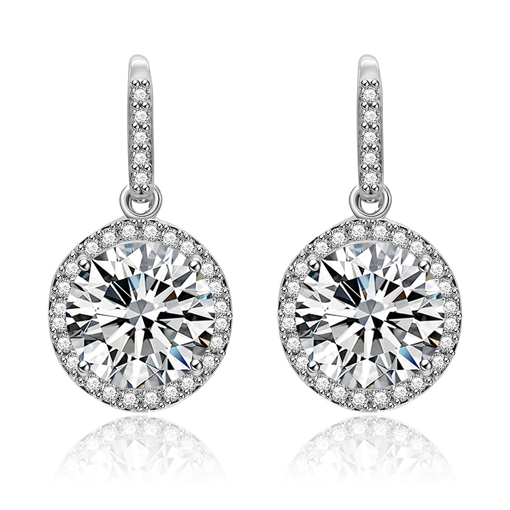A close-up view of the Double Round Dangle Earrings, showcasing the rhodium-plated brass setting and a large round cubic zirconia stone surrounded by a halo of smaller stones.
