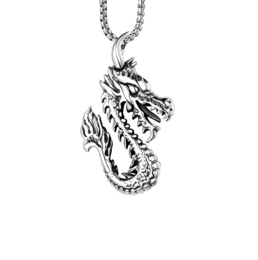 A detailed silver dragon pendant, showcasing intricate scales and design, perfect for men's fashion jewelry.
