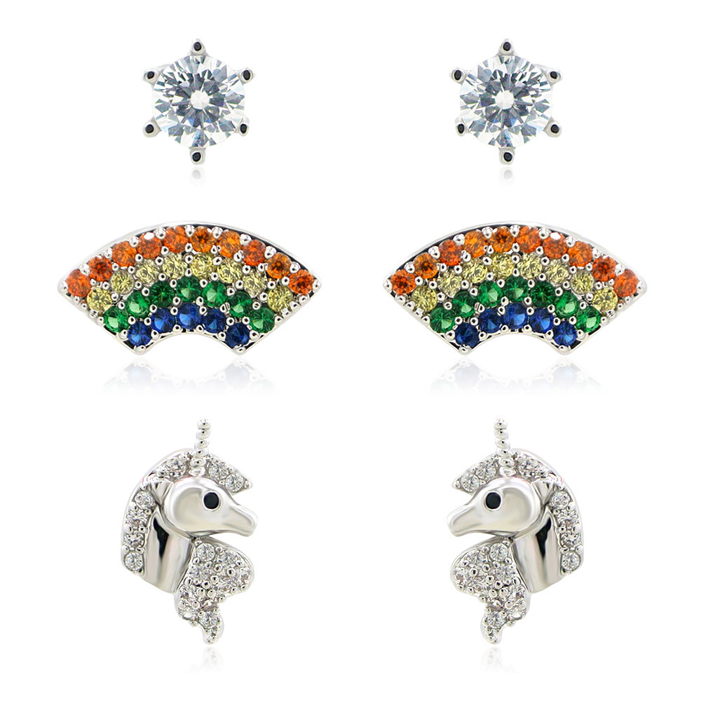 A set of three whimsical stud earrings: a silver unicorn, a colorful rainbow with cubic zirconia, and a single square CZ stone, displayed on a white background.