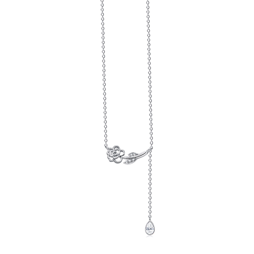 A close-up of the Modern Camellia Flower Necklace, showcasing its rhodium-plated brass floral design and a central teardrop cubic zirconia stone.