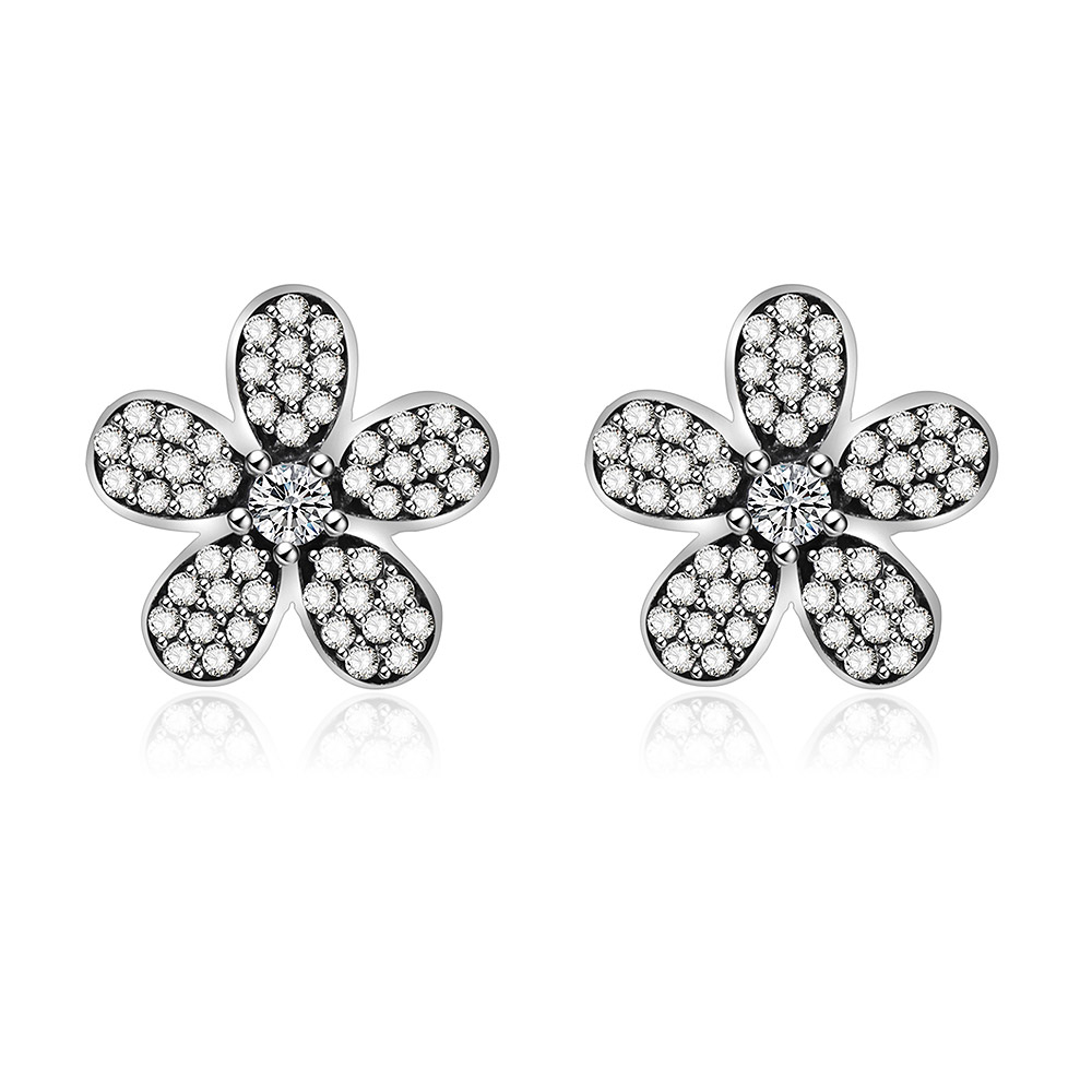 A detailed studio shot of Antique Flower Stud Earrings, showcasing the 925 sterling silver flower design with brilliant white cubic zirconia centers.
