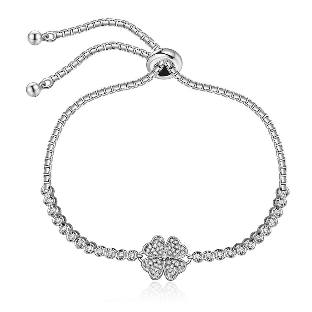The Clover Charms Wish Me Luck Bracelet featuring a silver-toned four-leaf clover charm set with sparkling cubic zirconia stones and an adjustable drawstring closure.