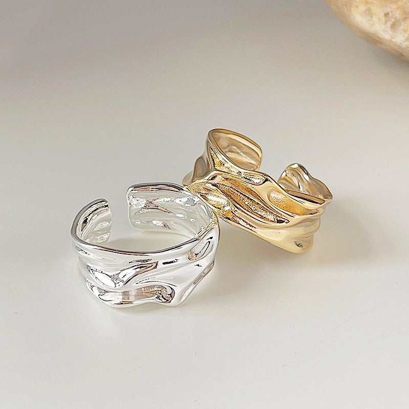 A set of geometrical polish irregular pleats open rings, showcasing both the gold and silver finish options against a clean white background.
