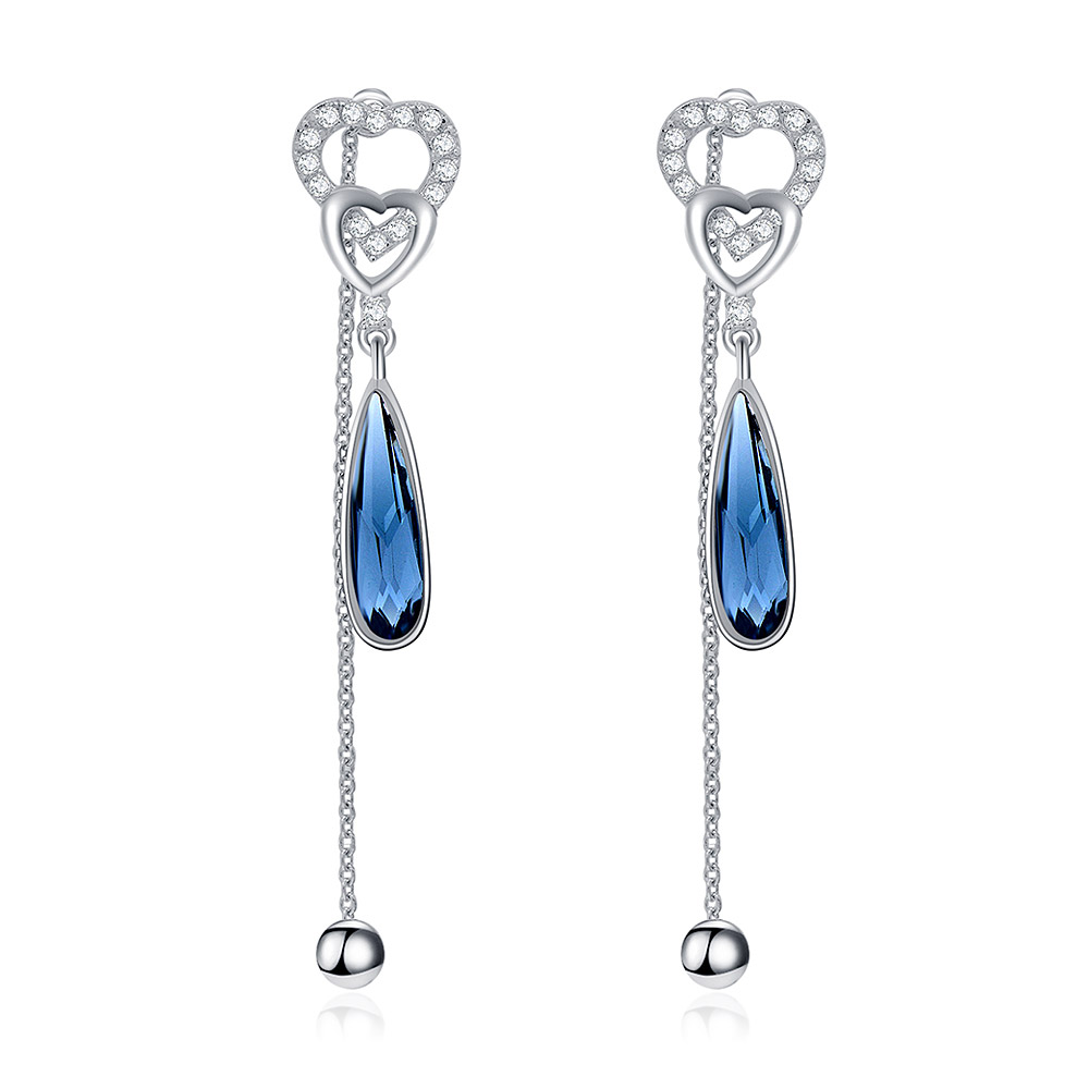 A pair of S925 sterling silver heart-shaped dangle earrings with blue Swarovski teardrop gemstones and delicate dangling chains.