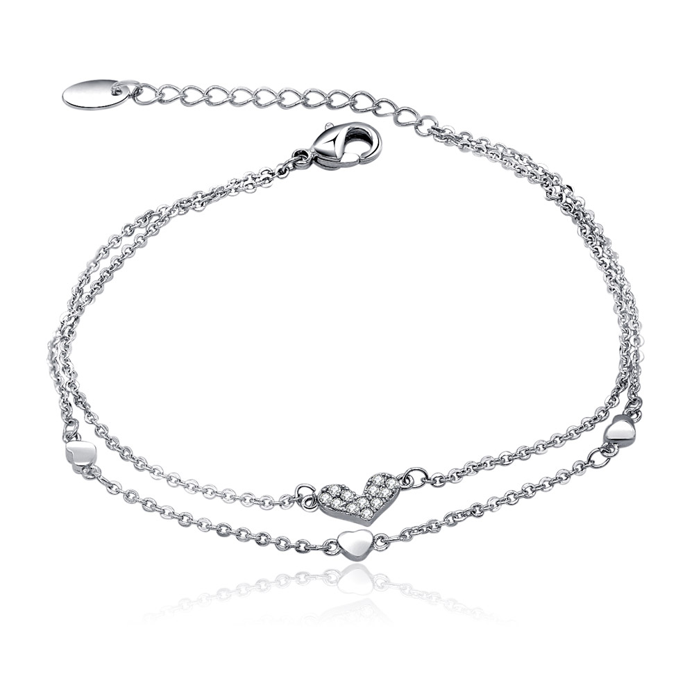 A close-up of the Double Chains Silver Heart CZ Charm Bracelet, showcasing its double-strand design and sparkling cubic zirconia heart charms on a white background.