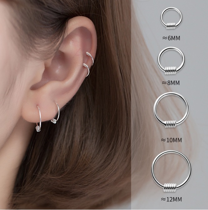 A model wearing various sizes of 925 sterling silver plain hoop earrings from JR Fashion Accessories, with a size comparison chart.