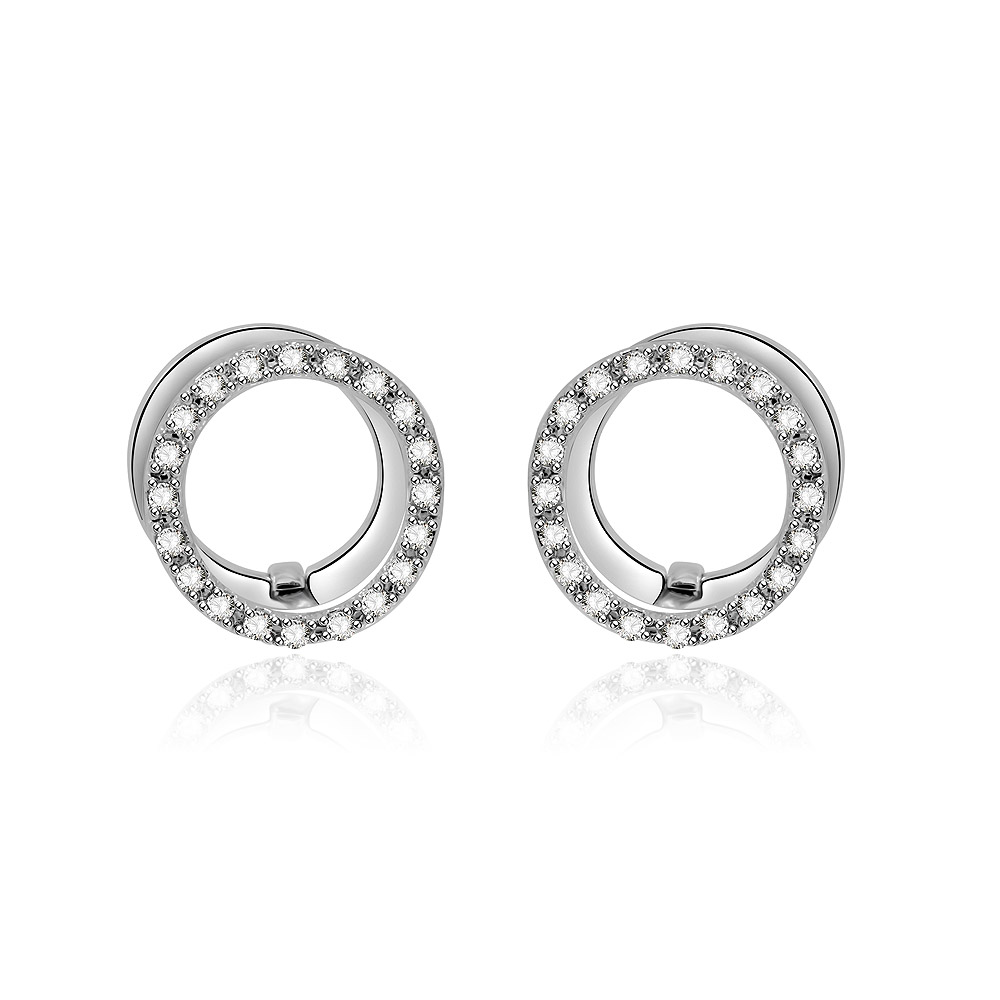 A detailed shot of the Circle Clear CZ Huggie Earrings, highlighting the rhodium-plated finish and the brilliant clear cubic zirconia stones.