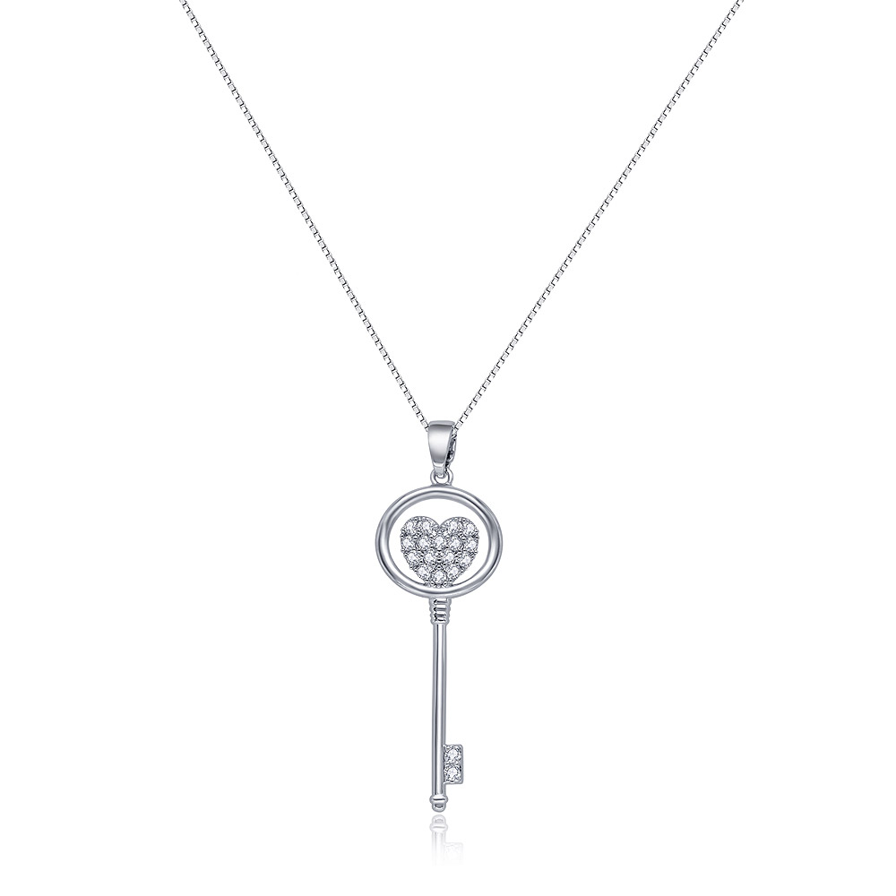 A close-up of the Open Your Heart key pendant necklace, showing the intricate heart design and sparkling cubic zirconia stones on a rhodium-plated finish.