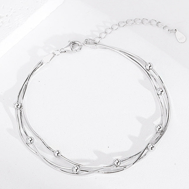 A set of 5 multi-strand 925 sterling silver bracelets with delicate beads, showcased on a clean white background.