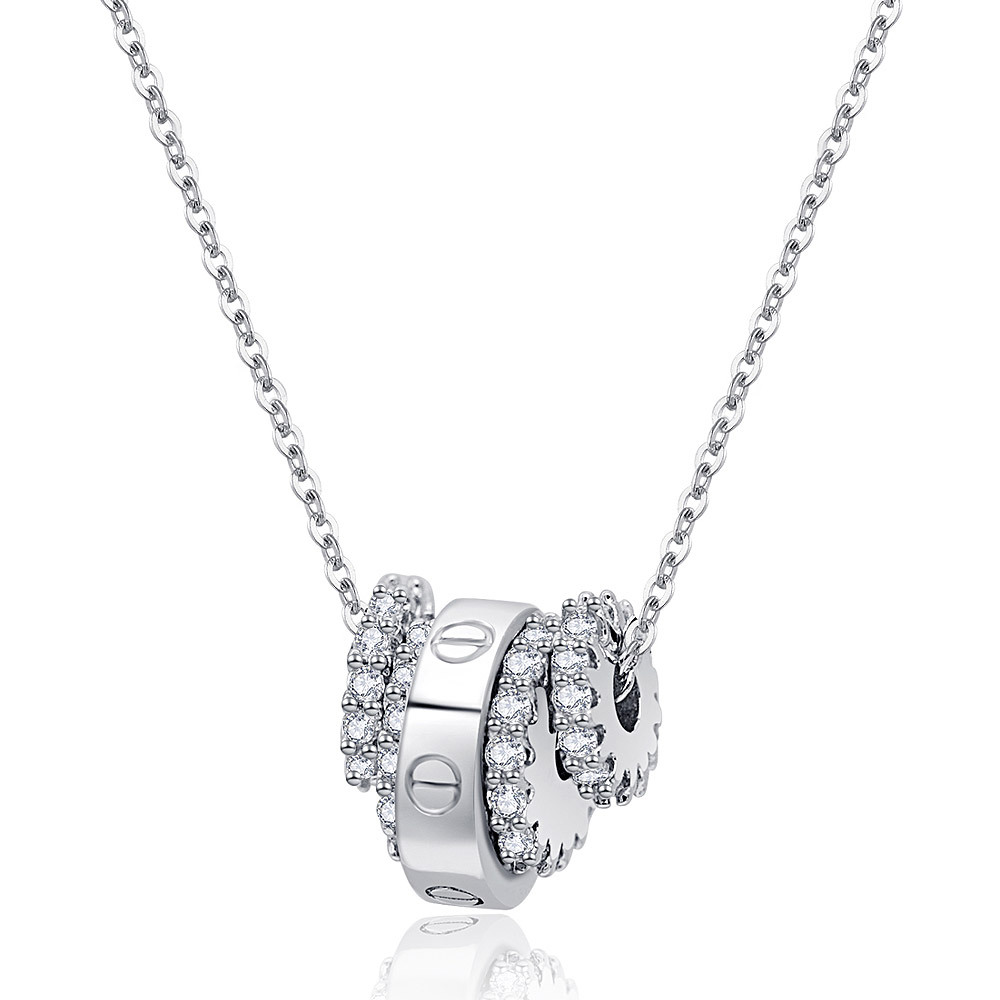 Close-up of the Pave Wheel Circles Necklace, showcasing the interlocking rings pendant adorned with sparkling cubic zirconia stones on a rhodium-plated brass chain.