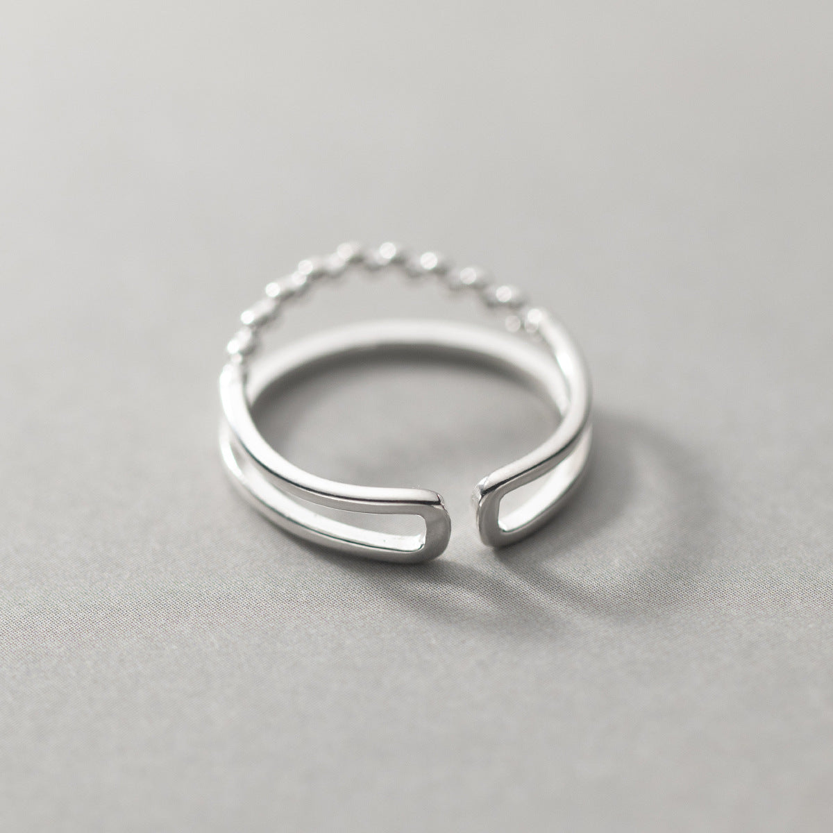 A unique open-ended 925 sterling silver ring from the Simple Beaded Double Layers set, showcasing its double-band design.
