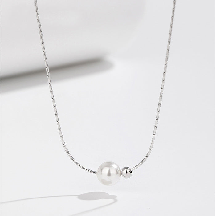 Elegant 925 sterling silver snake bone chain necklace featuring a lustrous white pearl and a delicate silver bead, on a clean white background.