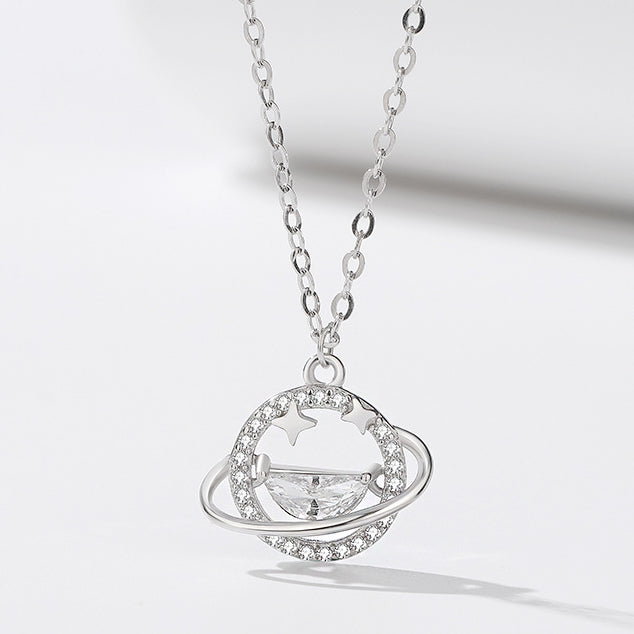 A detailed 925 sterling silver necklace featuring an intricate planet-themed pendant with a central gemstone, representing the star and universe collection.