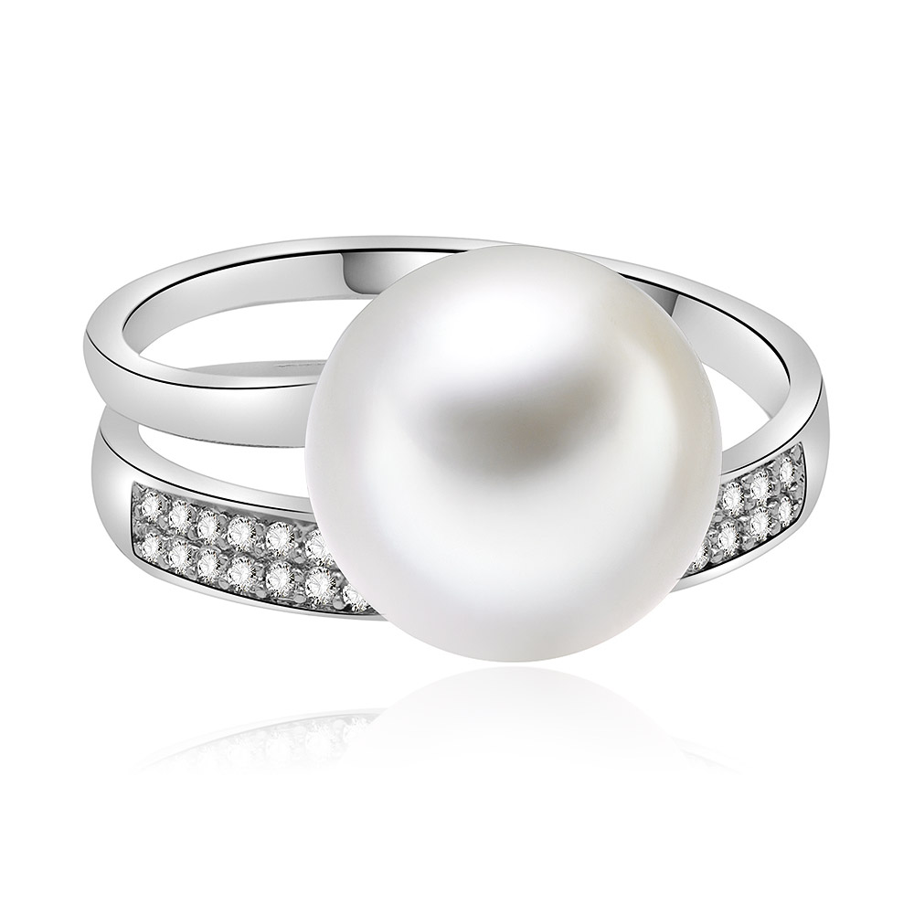 A close-up of the Swirl Pearl and CZ Ring, showcasing the intricate silver swirl design, central white pearl, and sparkling cubic zirconia accents.