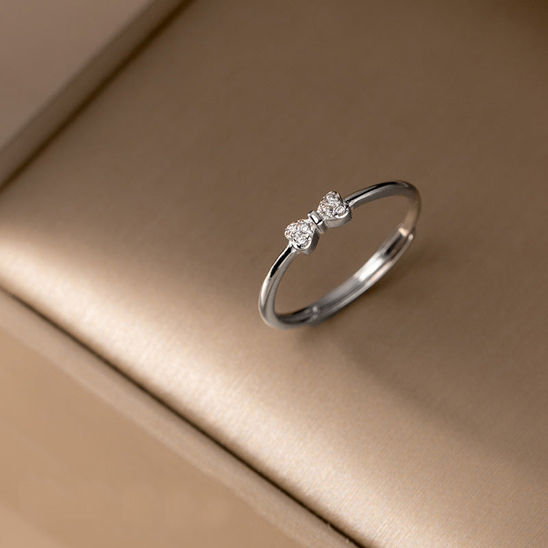 A close-up of the S925 sterling silver bow ring with three sparkling cubic zirconia stones.