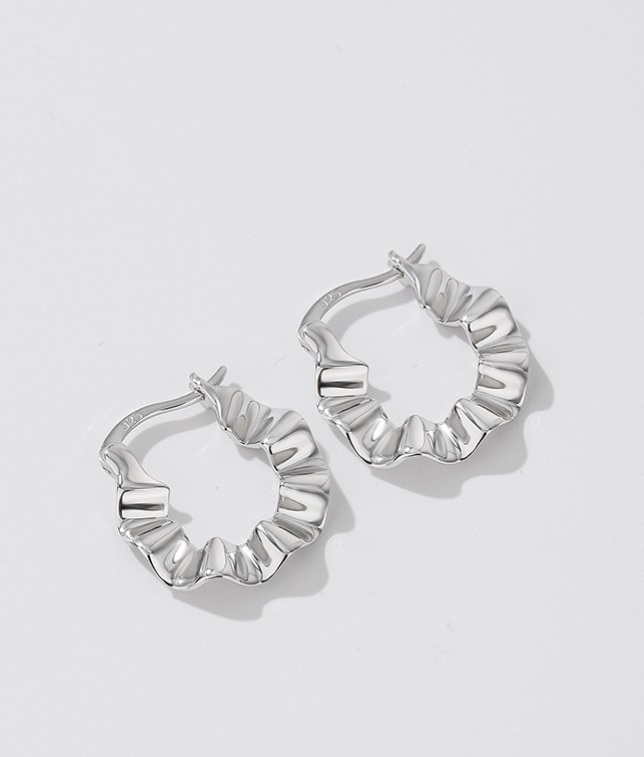 A close-up of the 925 Sterling Silver Wave Hoop Earring, showcasing its distinctive ruffled texture and secure post closure.