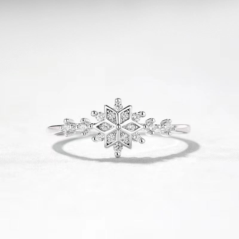 A stunning 925 sterling silver snowflake ring from the Starlight Sparkle set, featuring an intricate design with clear, brilliant zircon gemstones on a clean white background.