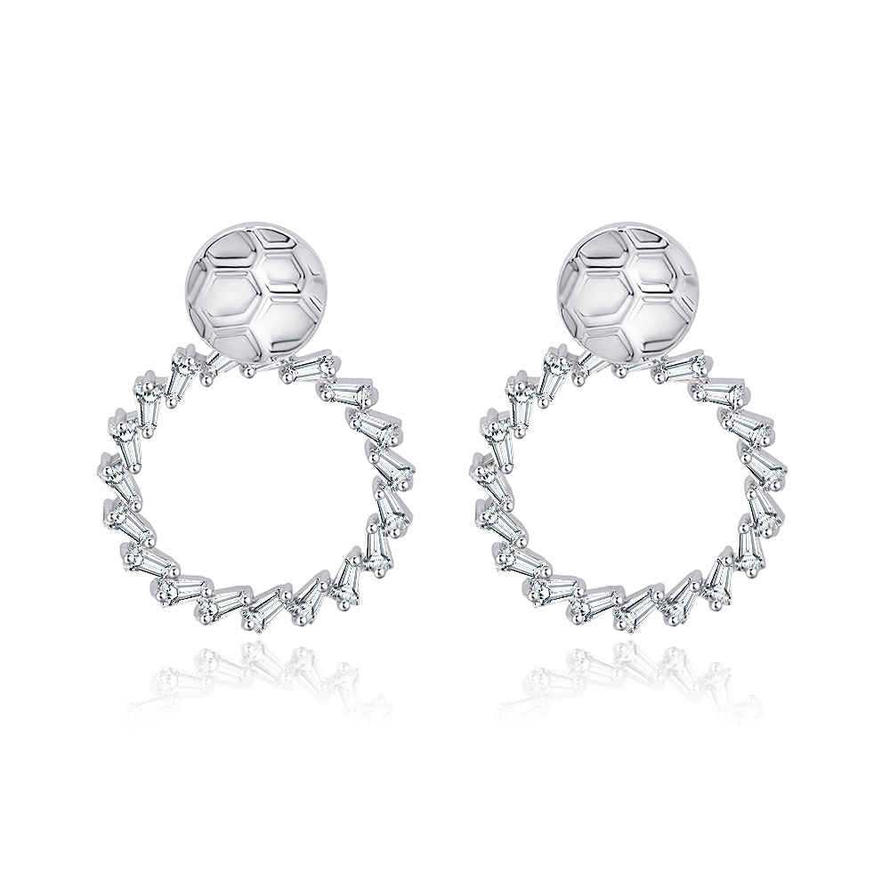 Close-up of wholesale hammered drop earrings with a unique soccer ball-inspired top and a hoop of sparkling baguette-cut cubic zirconia stones.