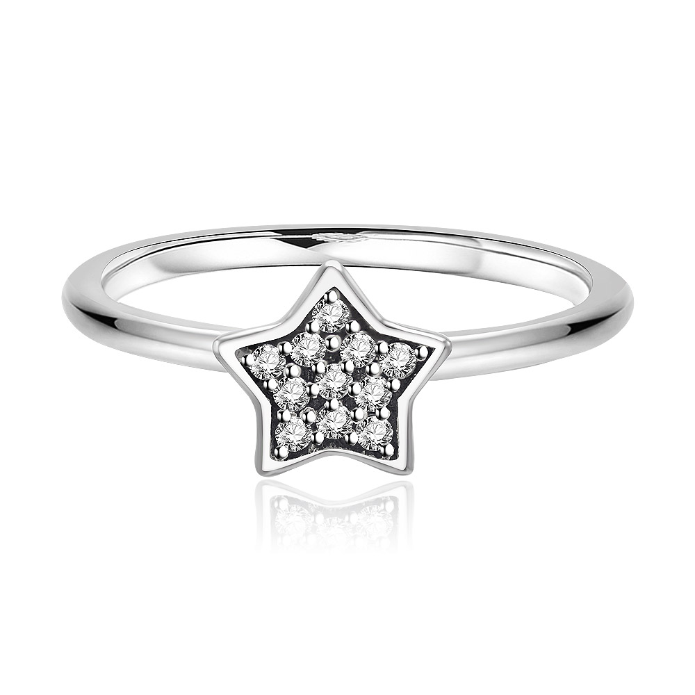 A close-up of the 925 sterling silver CZ star ring, showcasing the intricate starburst design paved with sparkling cubic zirconia stones on a polished silver band.