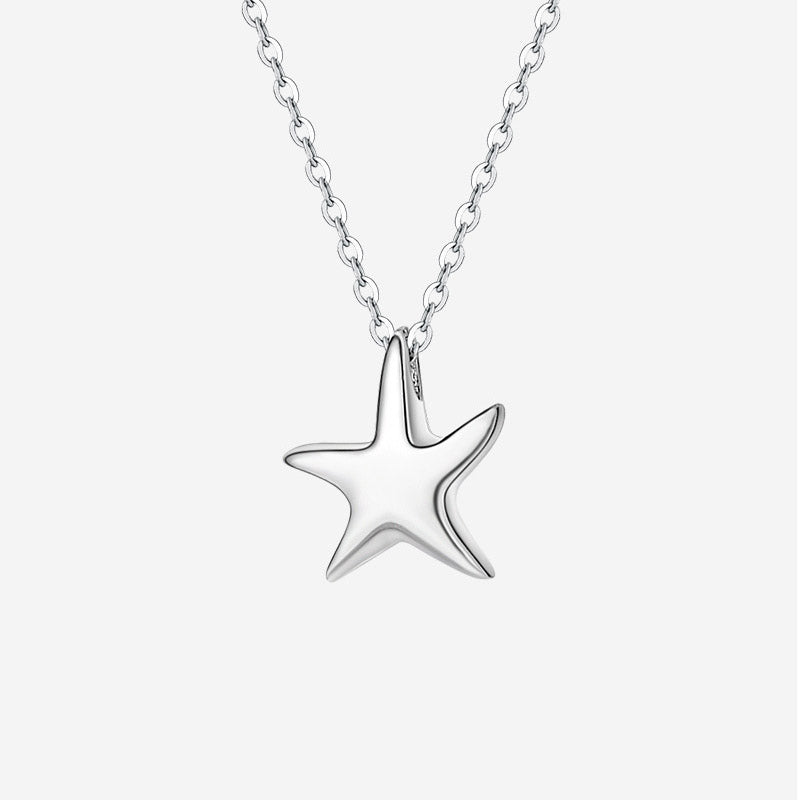 A close-up of a 925 sterling silver pendant necklace with a detailed tropical starfish charm, part of a five-piece set.