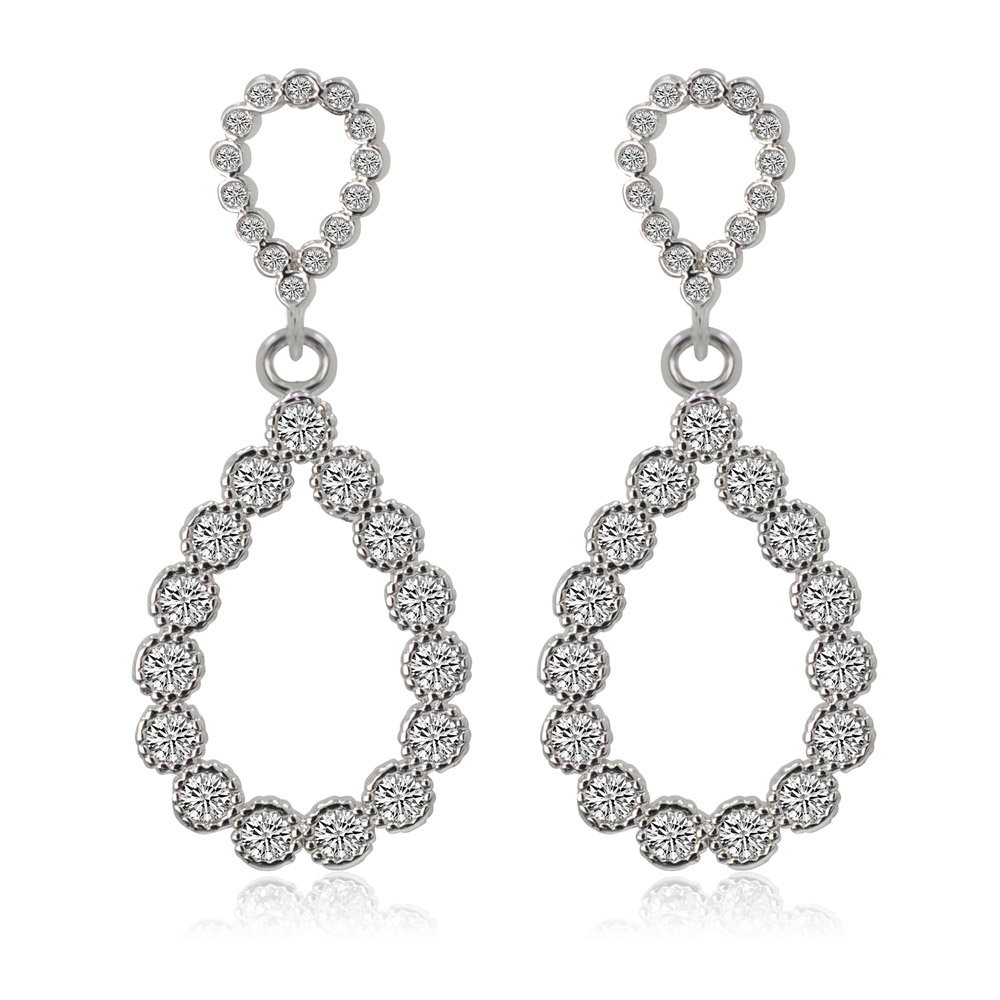 A pair of silver teardrop bezel set earrings featuring a double-layered design with sparkling cubic zirconia stones, presented on a clean white background.