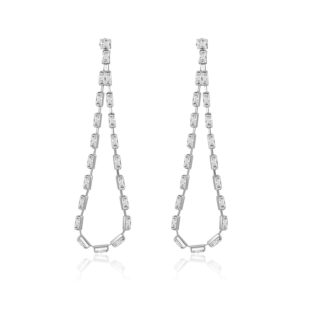 A close-up view of the Sweet Double Row CZ Dangle Earrings, showcasing their teardrop shape and sparkling rectangular-cut cubic zirconia stones set in rhodium-plated silver metal.