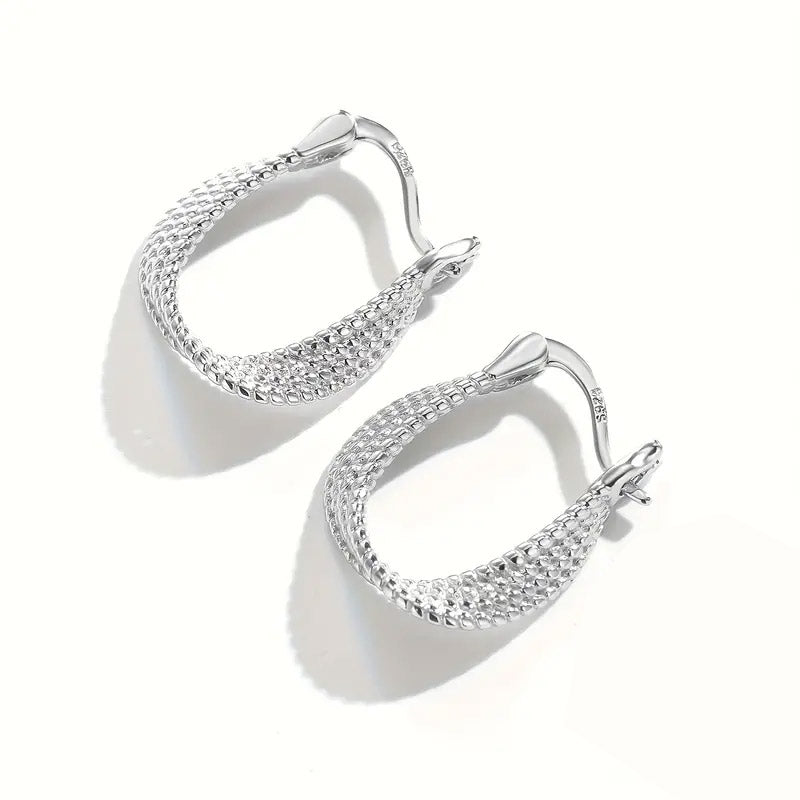 A pair of 925 sterling silver huggie hoop earrings with a detailed twisted, woven texture, shown against a clean white background.