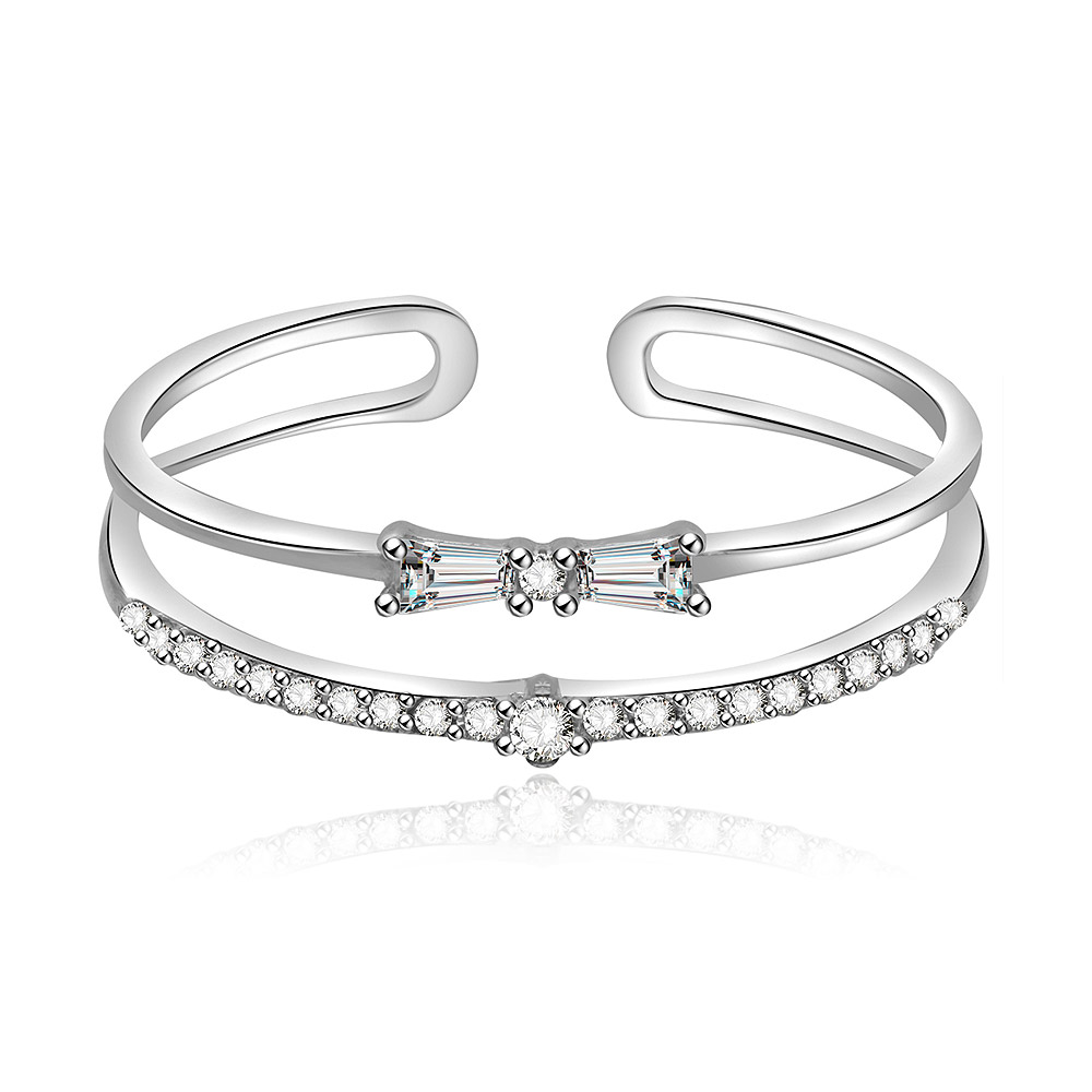 A beautifully crafted Tiny Bow Ring in 925 sterling silver, featuring a delicate bow centerpiece adorned with sparkling white cubic zirconia stones.