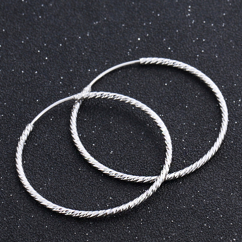 A pair of 925 sterling silver textured big hoop earrings, 37mm in diameter, showcasing a classic loop design.