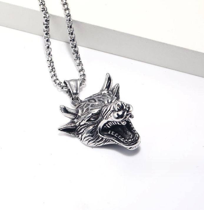 A detailed silver wolf head pendant on a stainless steel chain, representing a customizable animal necklace for men.
