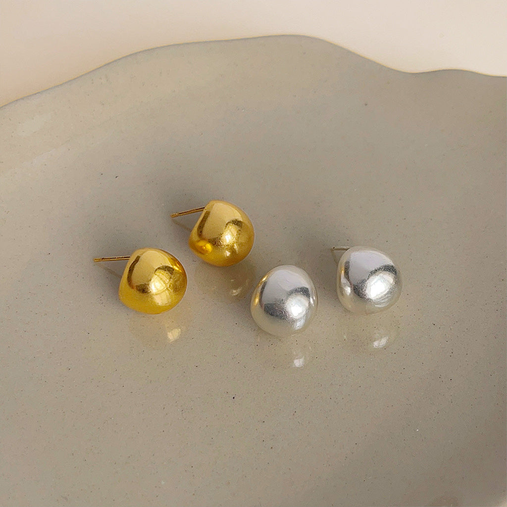 A set of simple rusty design small pea button stud earrings, showcasing two pairs in gold and silver plating, made from high-quality brass.