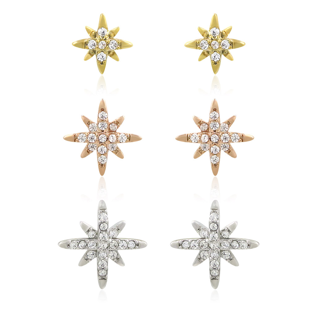 A set of three pairs of star stud earrings in gold, rose gold, and silver finishes, each adorned with sparkling cubic zirconia stones.