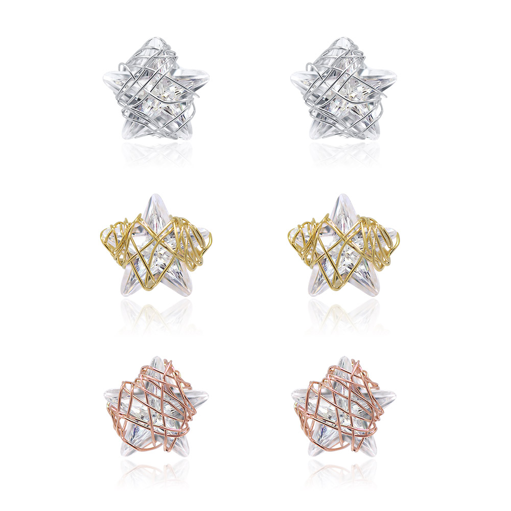 A set of three minimalist star-shaped stud earrings in gold, silver, and rose gold finishes, each featuring a sparkling cubic zirconia stone.