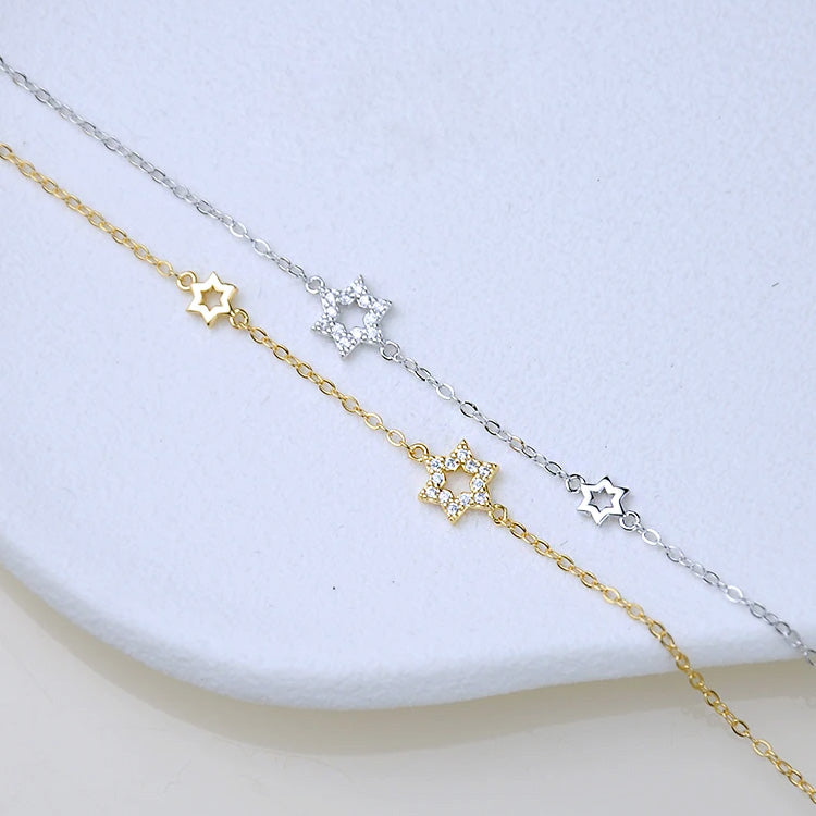 A set of 925 sterling silver hexagram star bracelets, showcasing both the elegant silver and luxurious gold-plated options on a clean white background.