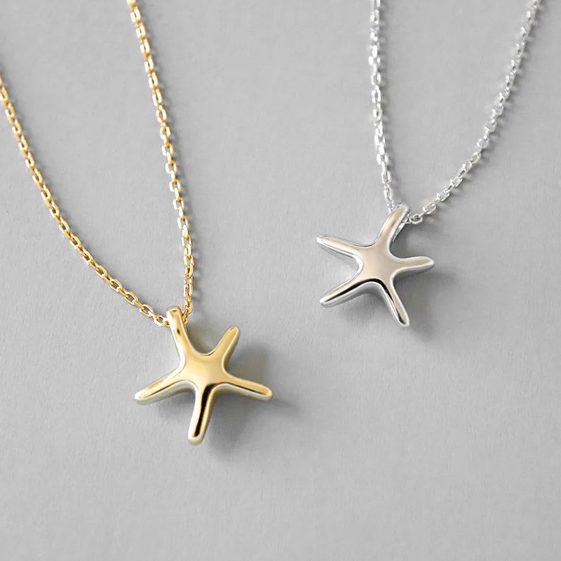 A pair of 925 sterling silver starfish necklaces, one in a polished silver finish and the other in a radiant gold finish, displayed side-by-side.